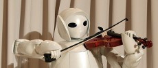 Toyota's violin-playing robot plays at Universal Design Showcase on December 6,2007 in Tokyo, Japan. The robot, which has 17 joints in both arms, uses precise control to play the violin. 