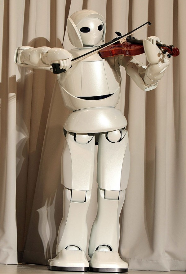 Toyota's violin-playing robot plays at Universal Design Showcase on December 6,2007 in Tokyo, Japan. The robot, which has 17 joints in both arms, uses precise control to play the violin. 