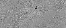 Transmitted to Earth on Dec. 24, 2015, this image from the Long Range Reconnaissance Imager (LORRI) extends New Horizons’ highest-resolution swath of Pluto to the center of Sputnik Planum, the informally named plain that forms the left side of Pluto’s “he