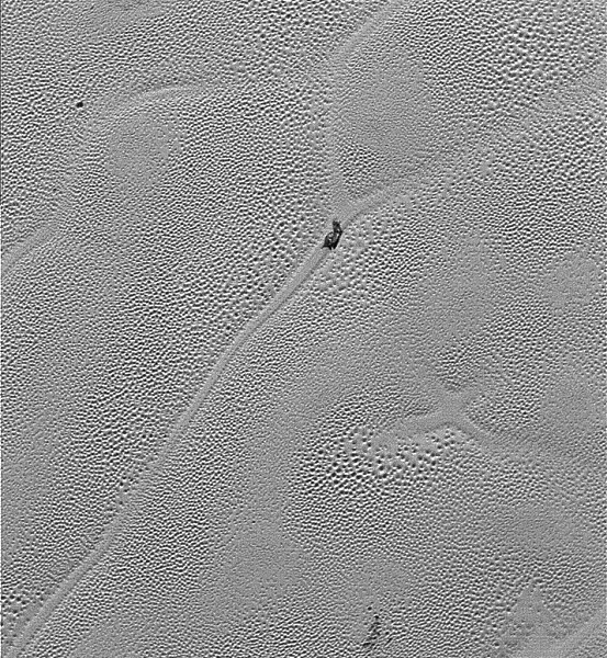 Transmitted to Earth on Dec. 24, 2015, this image from the Long Range Reconnaissance Imager (LORRI) extends New Horizons’ highest-resolution swath of Pluto to the center of Sputnik Planum, the informally named plain that forms the left side of Pluto’s “he