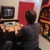 Gamers check out a vintage console at a museum in Berlin