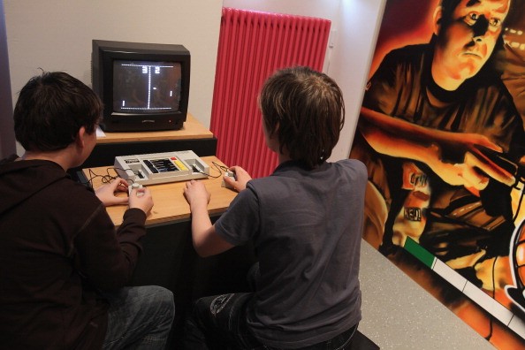 Gamers check out a vintage console at a museum in Berlin