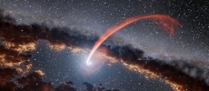 This illustration shows a glowing stream of material from a star as it is being devoured by a supermassive black hole in a tidal disruption flare.