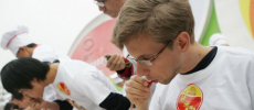 A man eating a chili pepper. A new study has concluded that the preference among some people for chili pepper and other foods abhorred by others is the result of an acquired taste.