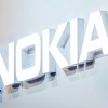 A logo sits illuminated outside the Nokia pavilion on the opening day of the World Mobile Congress at the Fira Gran Via Complex in Barcelona, Spain. 