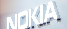 A logo sits illuminated outside the Nokia pavilion on the opening day of the World Mobile Congress at the Fira Gran Via Complex in Barcelona, Spain. 