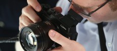 A visitor tries out the Lumix DMC-GX8 digital camera at the Panasonic stand at the 2015 IFA consumer electronics and appliances trade fair in Berlin, Germany.