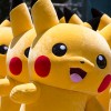 Performers dressed as Pikachu, a character from Pokemon series game titles, march during the Pikachu Outbreak event hosted by The Pokemon Co. in Yokohama, Japan. 