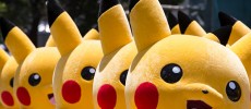 Performers dressed as Pikachu, a character from Pokemon series game titles, march during the Pikachu Outbreak event hosted by The Pokemon Co. in Yokohama, Japan. 