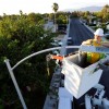 A field electrician replaces a streetlight with new LED fixtures  in Las Vegas, Nevada.