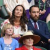 Pippa Middleton and her brother James Middleton watch on from the stands during the Men's Singles first round match between Novak Djokovic of Serbia and James Ward of Great Britain.