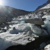 Large chunks of ice stand melting in the sun near the foot of the Hornkees glacier in Austria. 