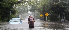 A man walks through a flooded street as Hurricane Matthew passes through the area in St Augustine, Florida.