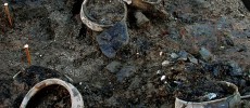 Whole pots, fragments of textiles and other material from the timber dwelling after the structure was destroyed by fire. 