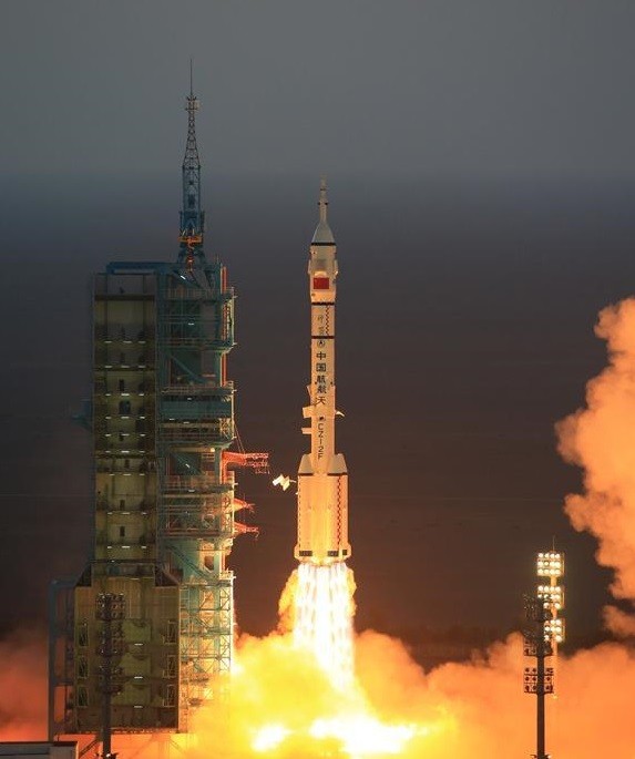The Shenzhou-11 spacecraft is launched on top of a Long March booster rocket in China's Gobi Desert on Sunday.