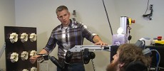 Researcher Dr. Robert Gaunt prepares Nathan Copeland for sensory testing, where Nathan feels his fingers through the mind-controlled robotic arm.