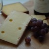Scientists have found out why wine tastes better with cheese.