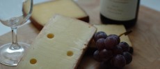 Scientists have found out why wine tastes better with cheese.