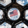 Kjell Lindgren posted this image on social media of the US flag floating in the Cupola module. (NASA/Tumblr)