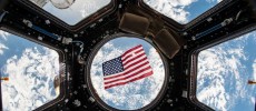 Kjell Lindgren posted this image on social media of the US flag floating in the Cupola module. (NASA/Tumblr)