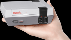 The NES Classic in a hand to highlight the size of the game console. (Nintendo)