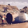 This massive metal cylinder fell from the sky and crashed in a jade mine in Myanmar. (Facebook)